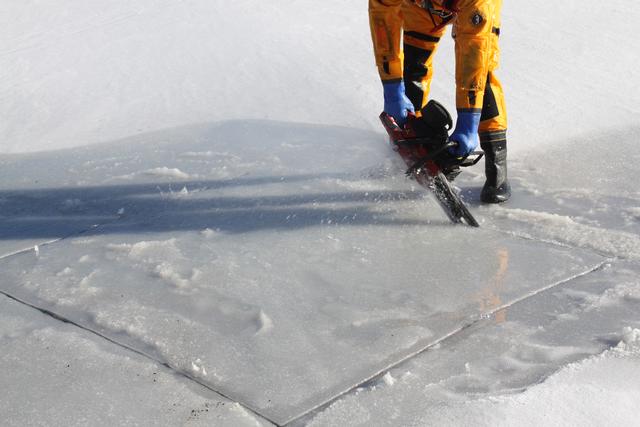 FF J. Cobb Cutting the Hole in the ice